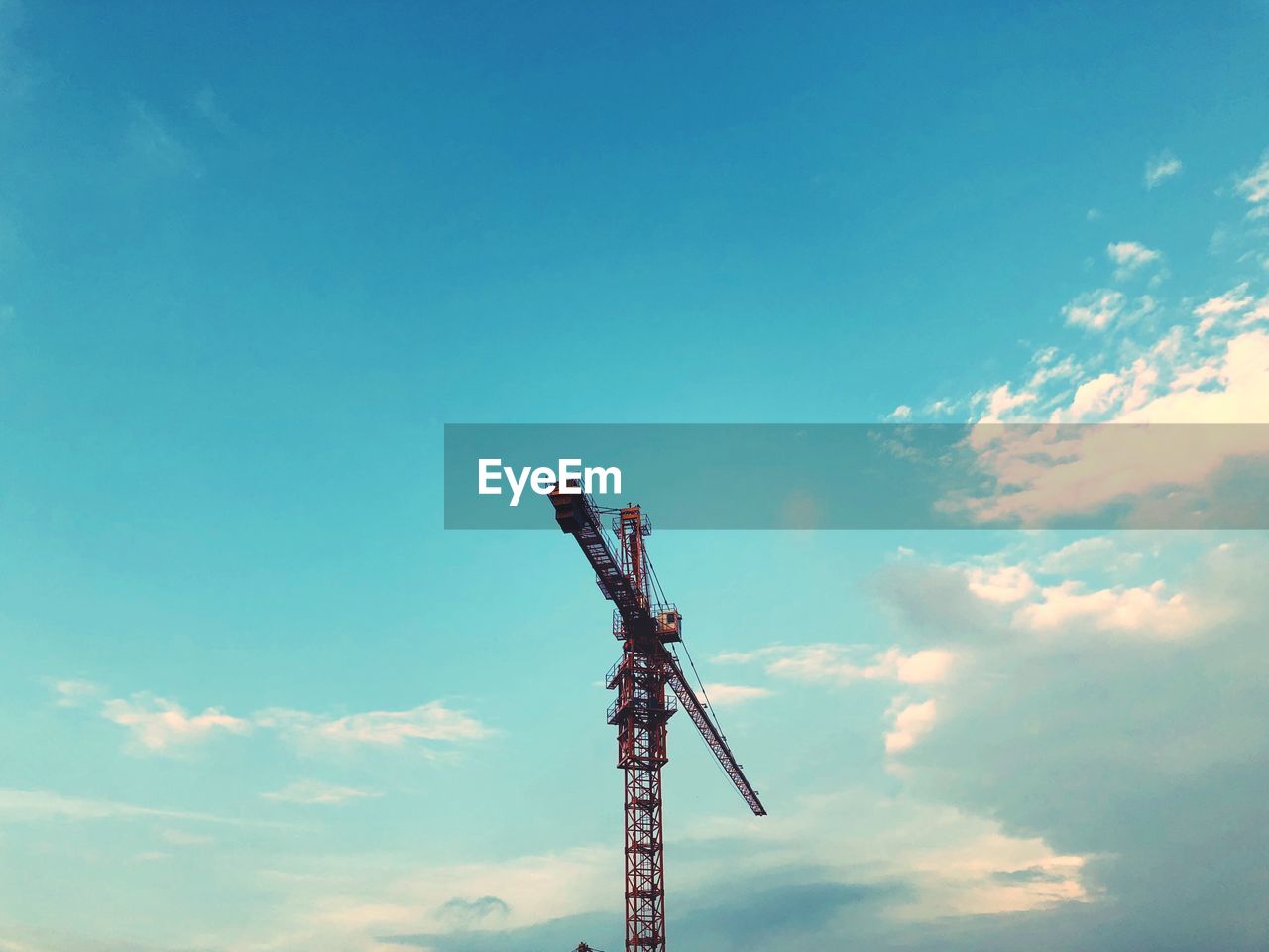 Low angle view of communications tower against sky