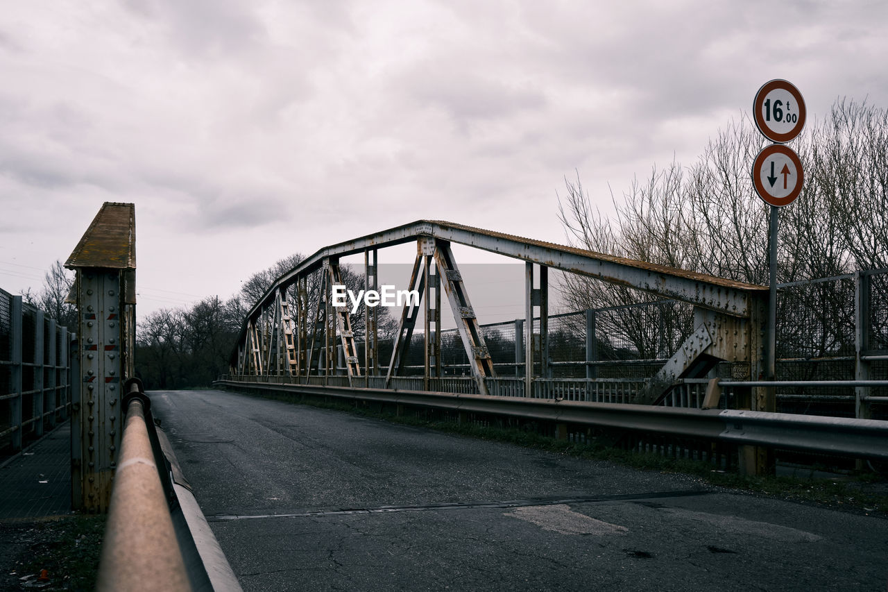 View of bridge against cloudy sky