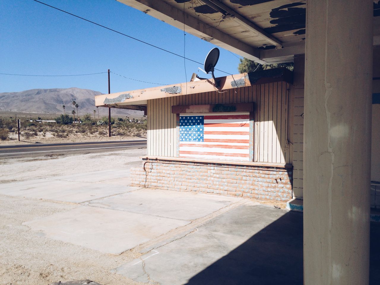 American flag on building by road