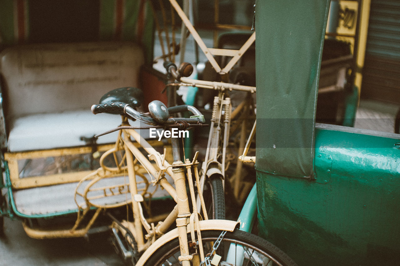 Pictures of a old tricycle, used to be a useful way for people to travel, got abundant nowadays 