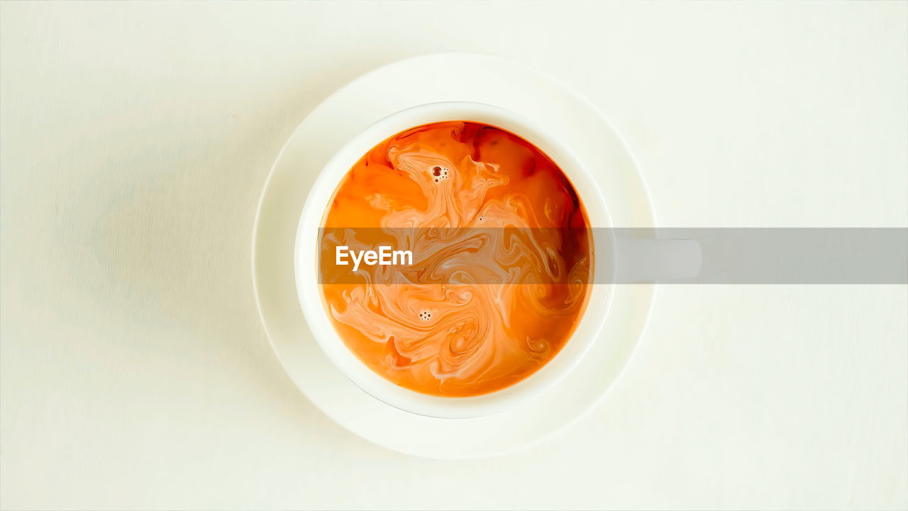 food and drink, food, healthy eating, indoors, dish, produce, wellbeing, directly above, freshness, no people, studio shot, orange color, bowl, vegetable, still life, high angle view, white, copy space