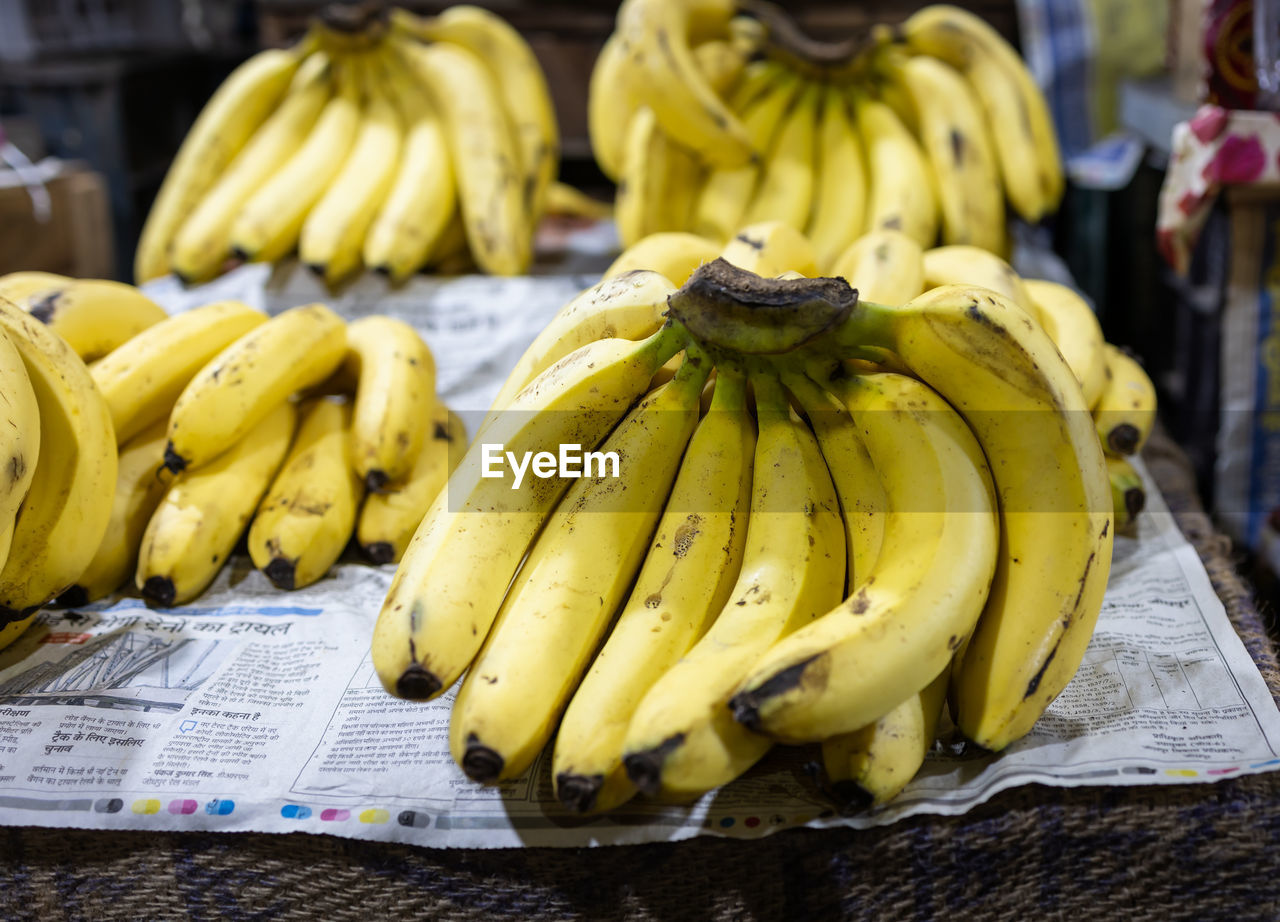 Fresh yellow ripe banana at fruit store for sale at evening