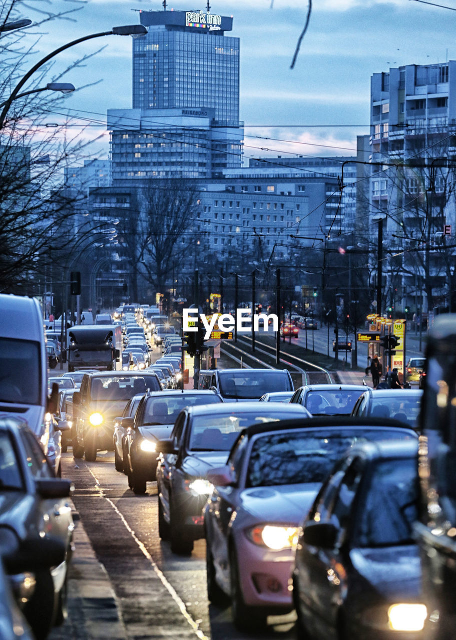 Cars on street in city at dusk