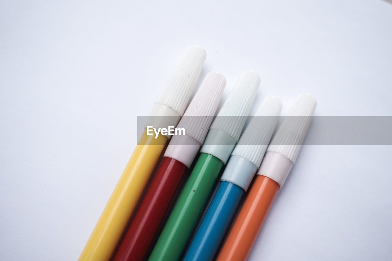 Close-up of colorful felt tip pens on white background