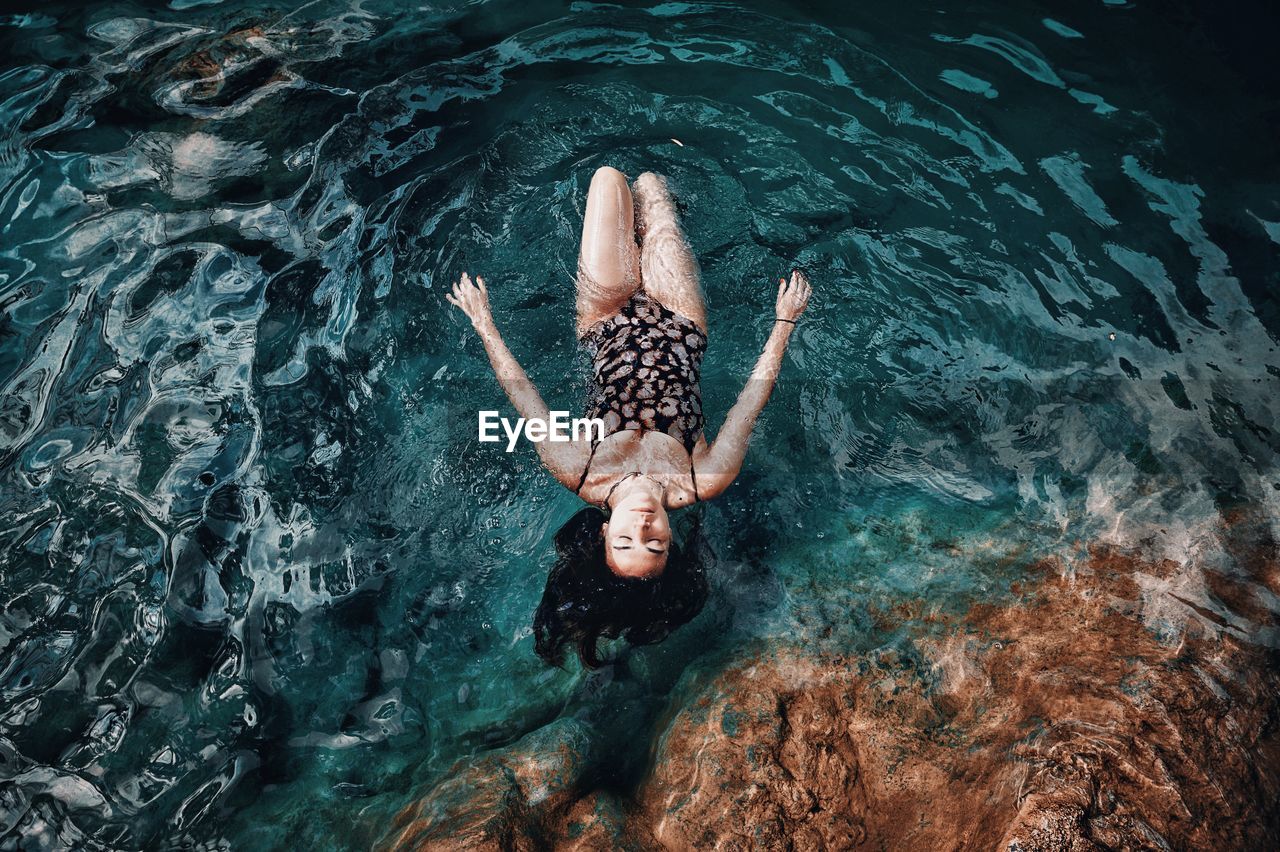 High angle view of person swimming in sea