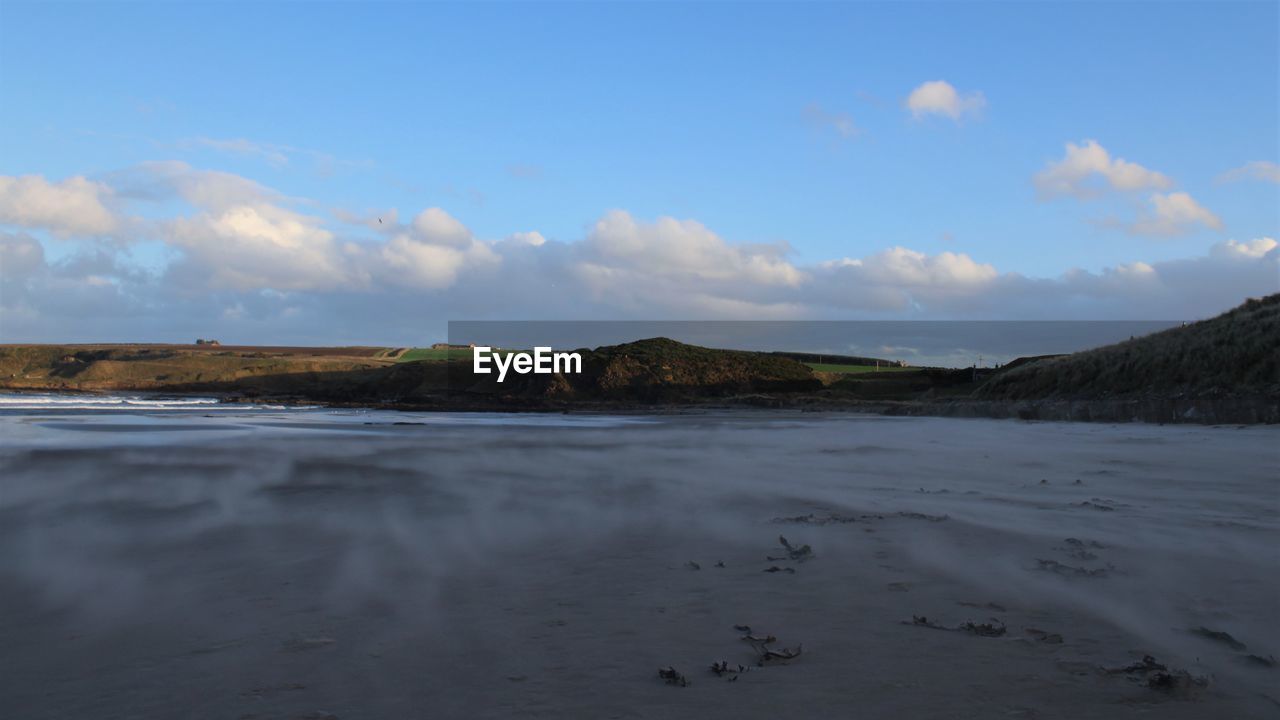 Scenic view of beach against sky