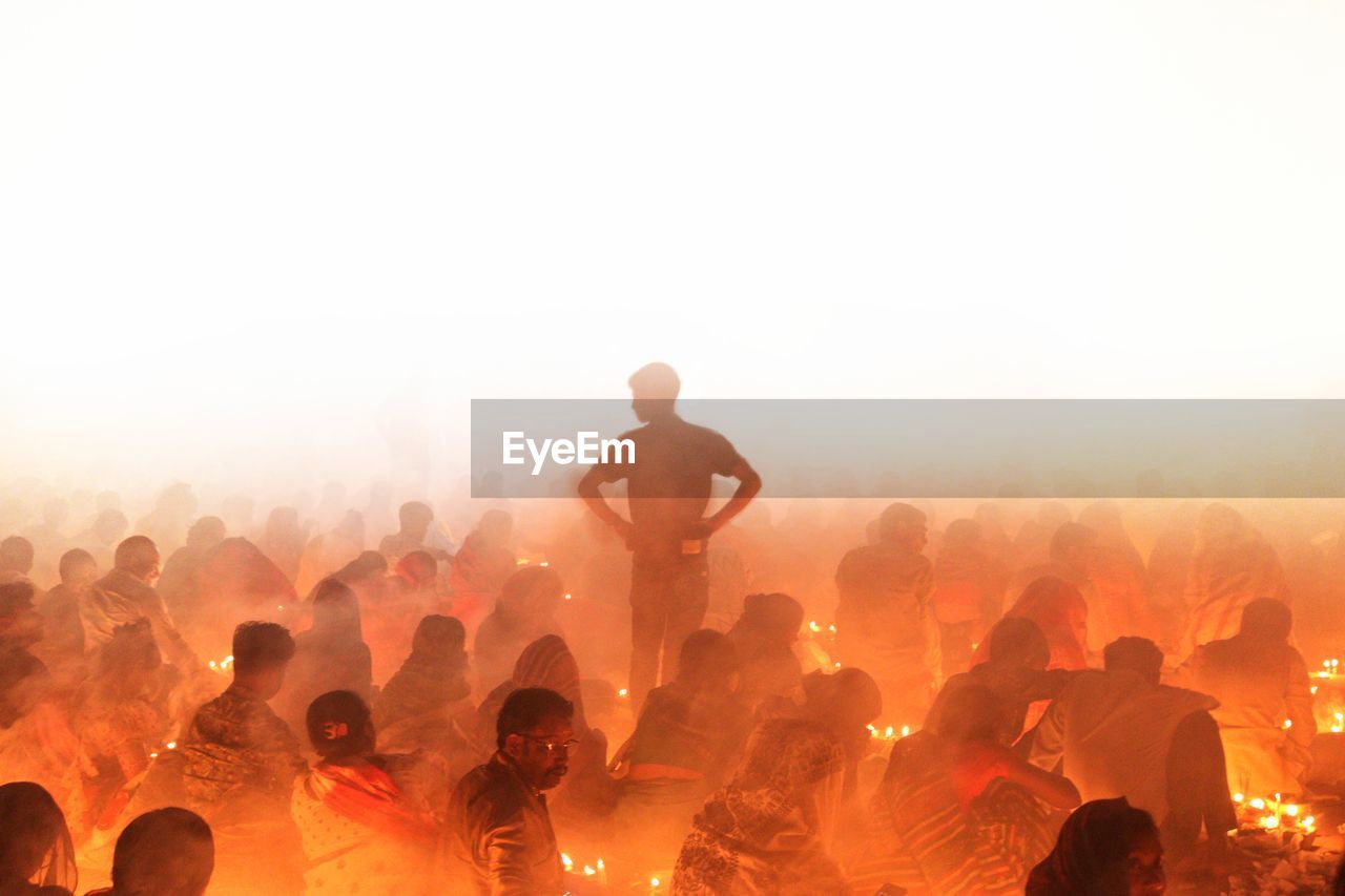 Man standing inside croud in rakher upobash