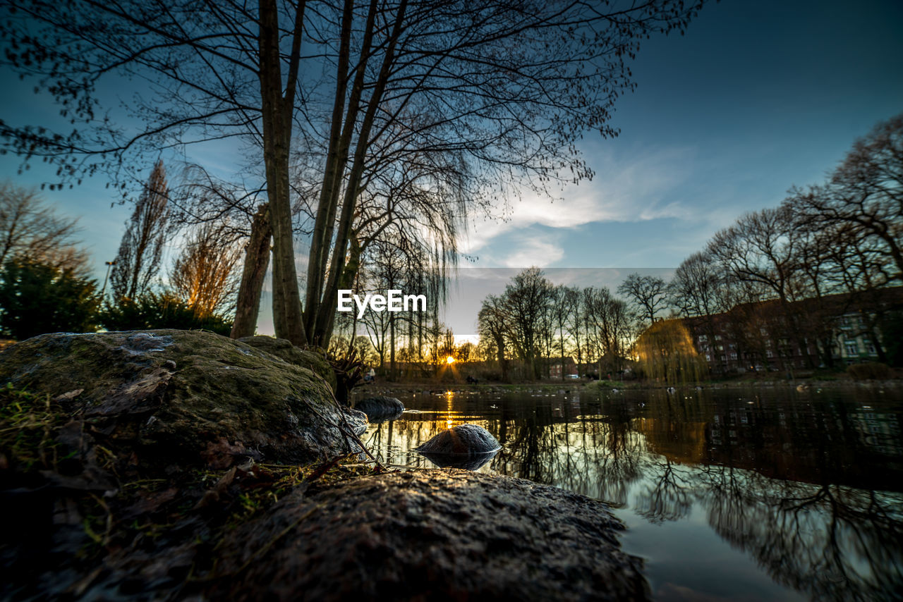 Scenic view of lake against sky during sunset