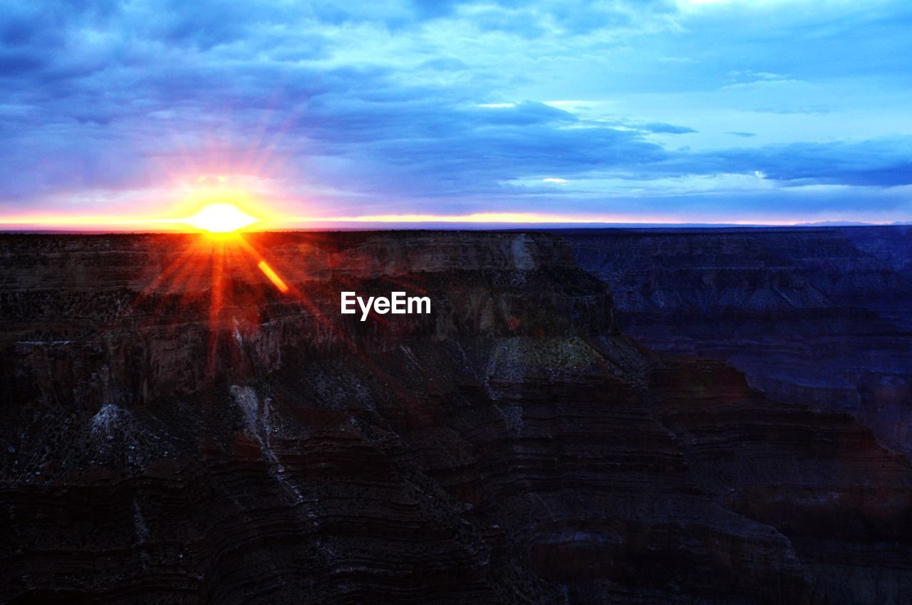 SCENIC VIEW OF SUNSET OVER LANDSCAPE