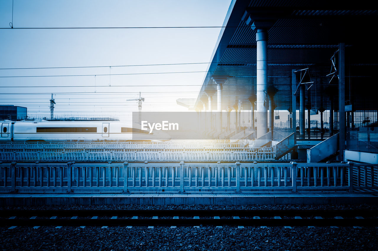 RAILROAD STATION PLATFORM AGAINST SKY