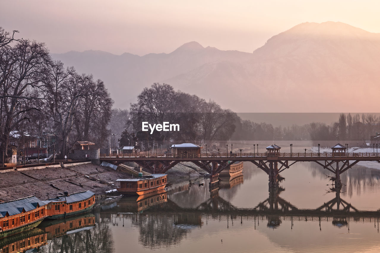 Bridge over river against sky during sunrise, srinagar kashmir 