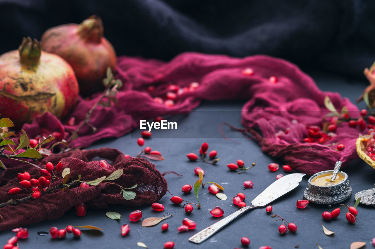 CLOSE-UP OF FRUITS ON TABLE AT HOME