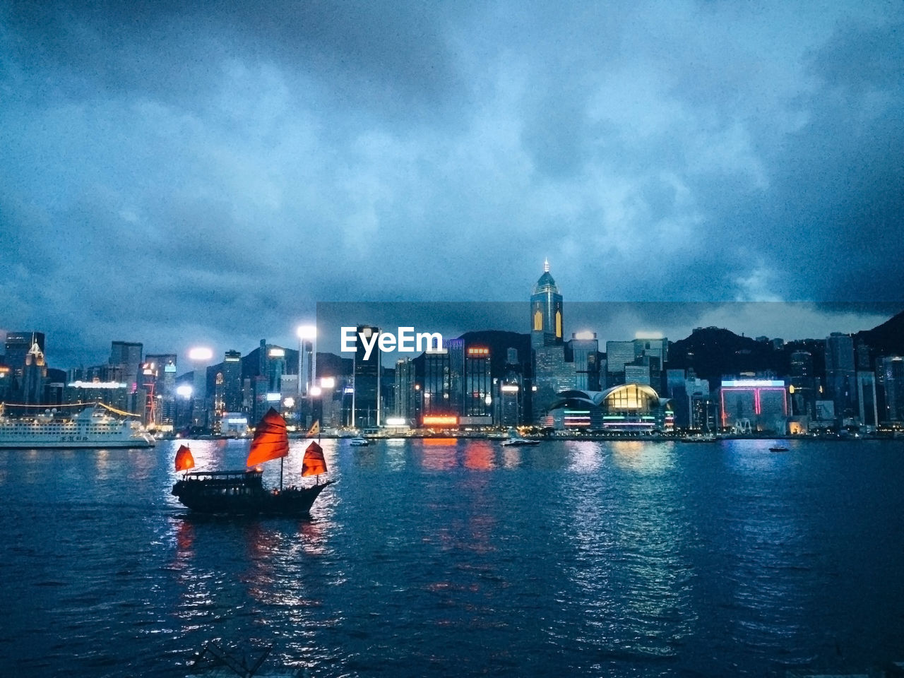 Boats in river with buildings in background