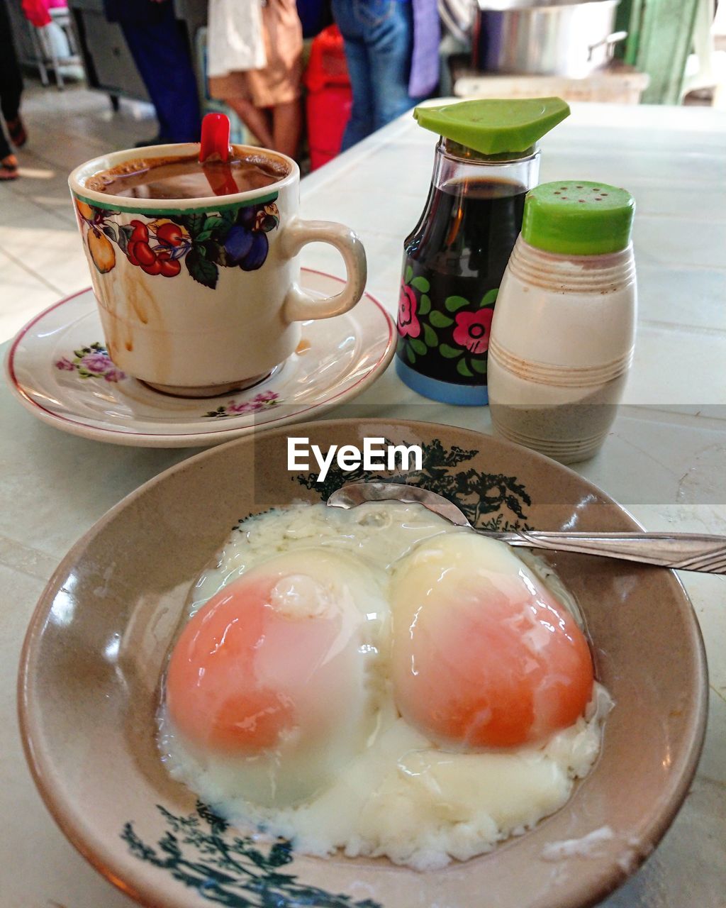 Close-up of drink and eggs on table