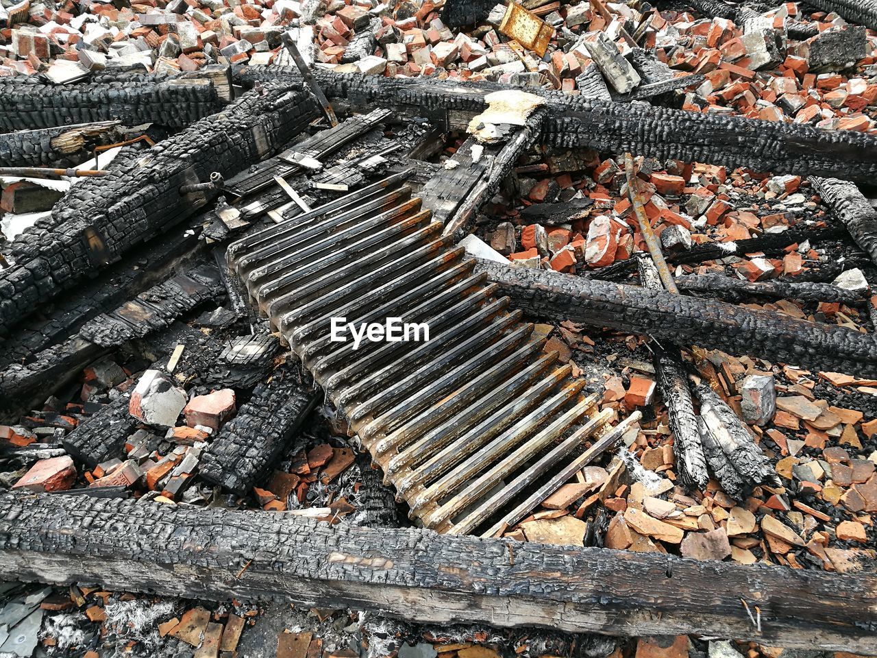 High angle view of burnt wood on field