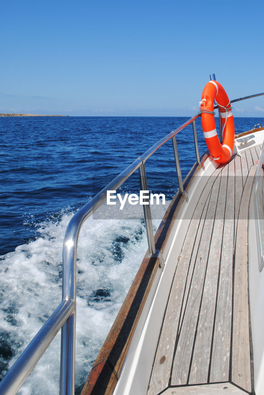 The spray of a fast-moving motor boat. view from board.