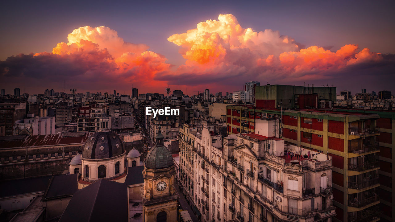 HIGH ANGLE VIEW OF BUILDINGS AT SUNSET