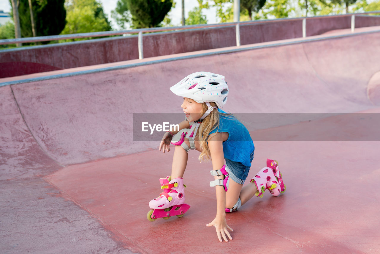 Full length of cute girl inline skating at park