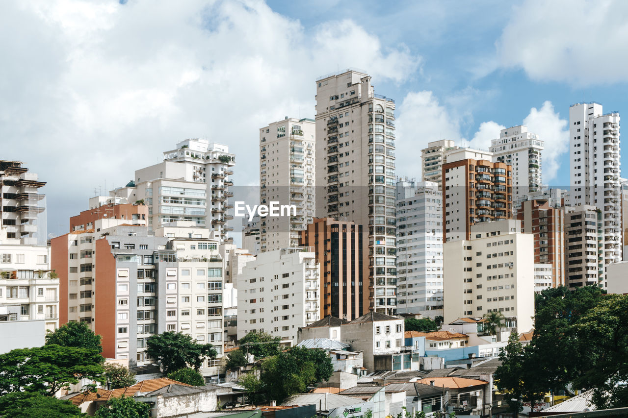 Buildings in big city against sky