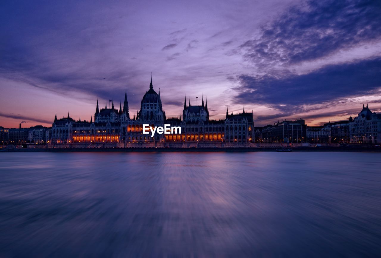 Hungarian parliament building against sky at dusk