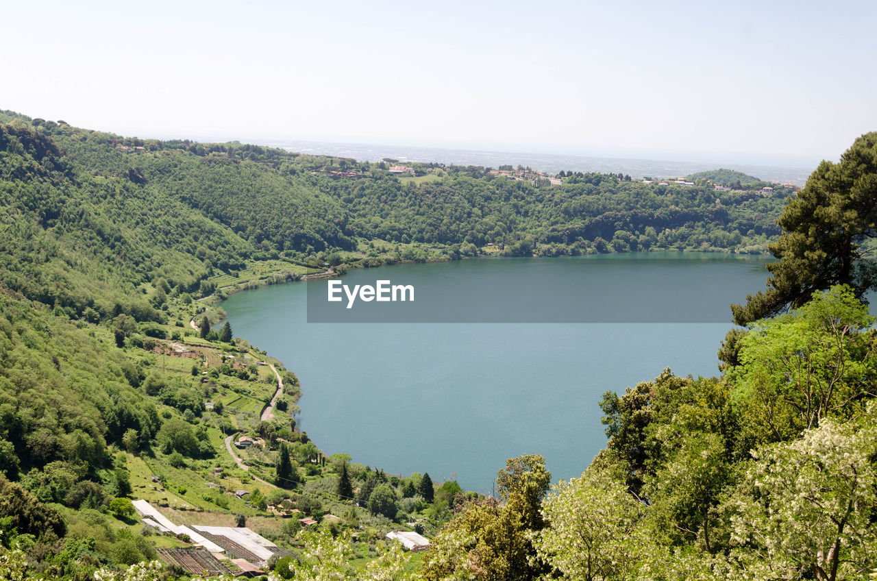 Scenic view of lake and trees against sky