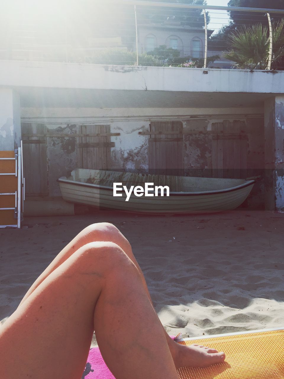 Low section view of person relaxing on beach