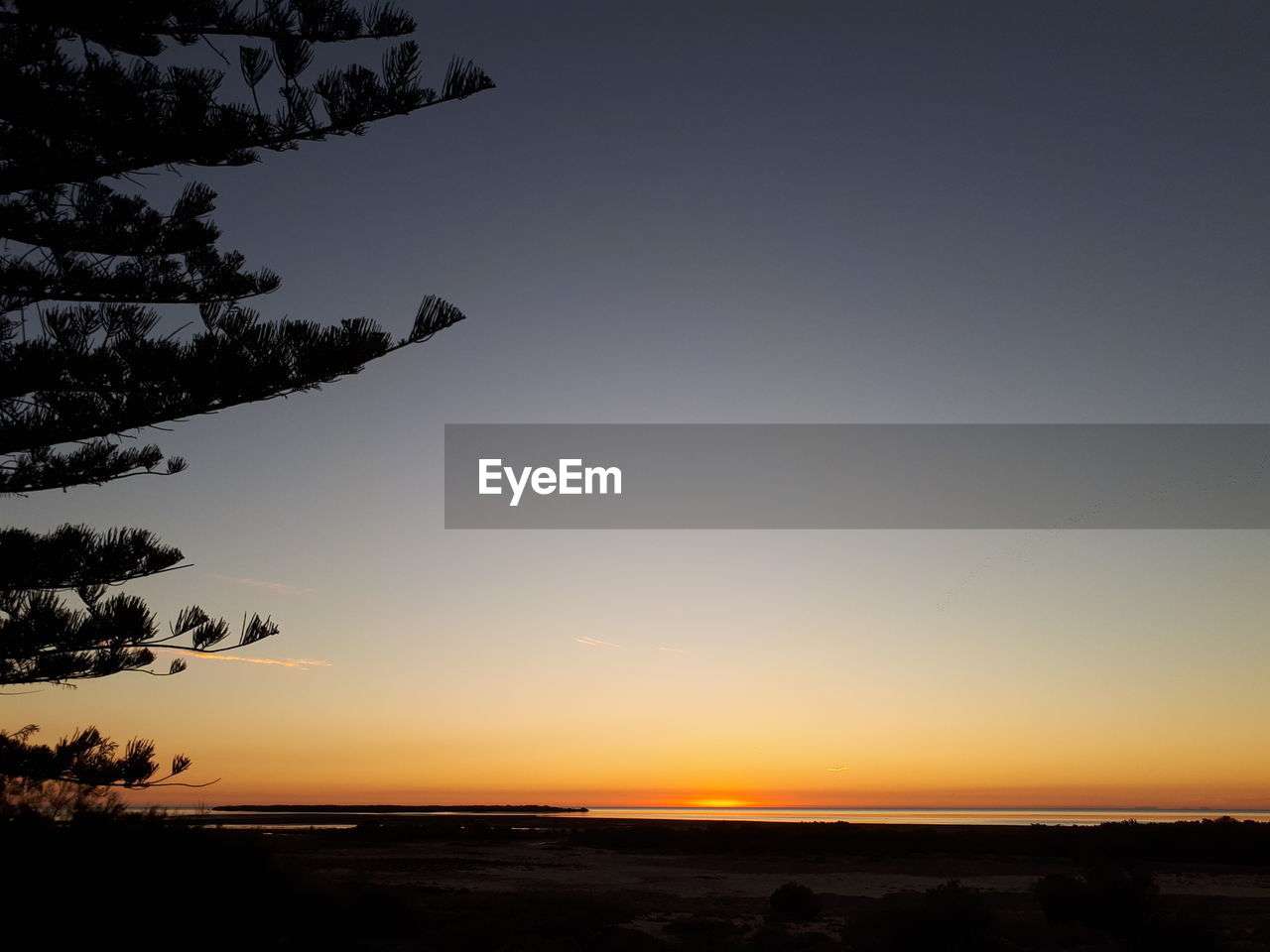 Scenic view of silhouette landscape against sky during sunset