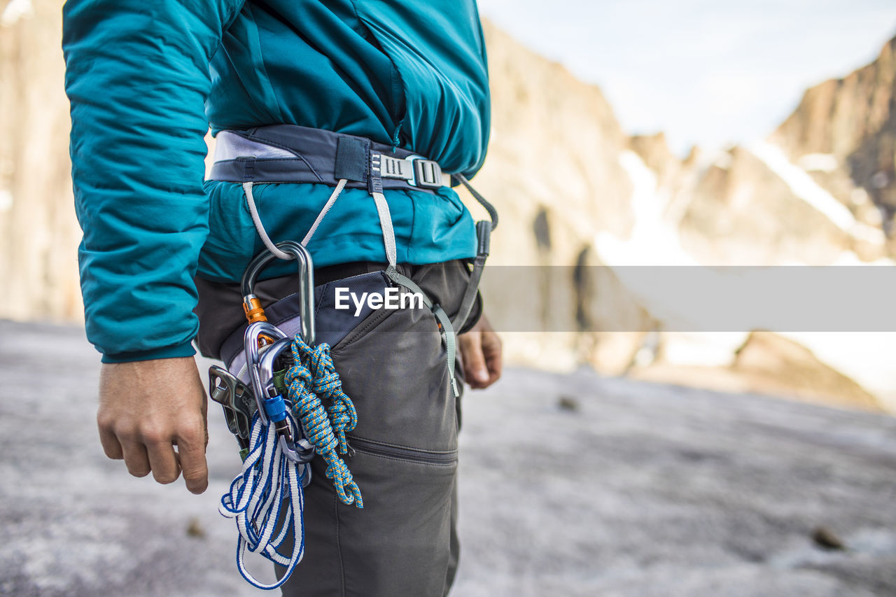 Side view of climbers harness and safety gear.
