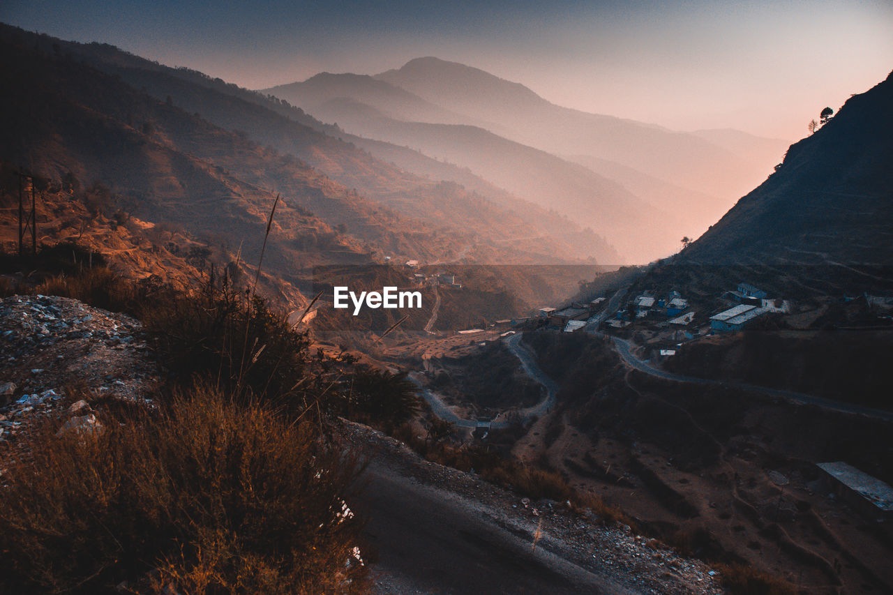 Scenic view of mountains against sky during sunset