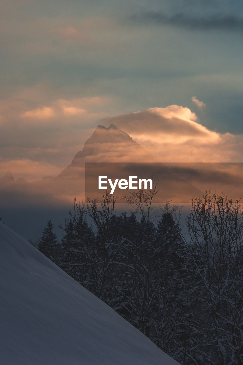 Scenic view of mountain against sky during sunset