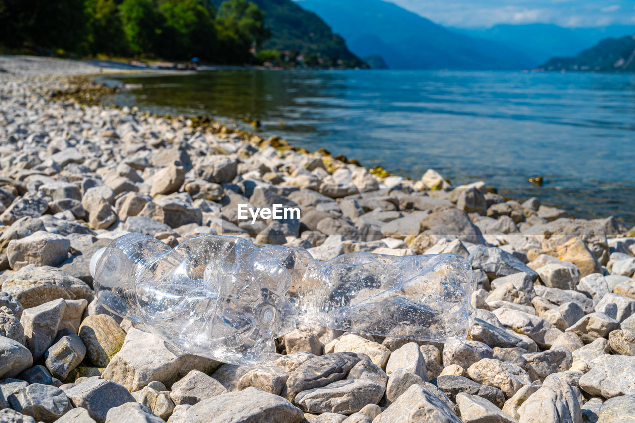 Plastic bottles abandoned on a beach. water pollution, microplastics, waste.