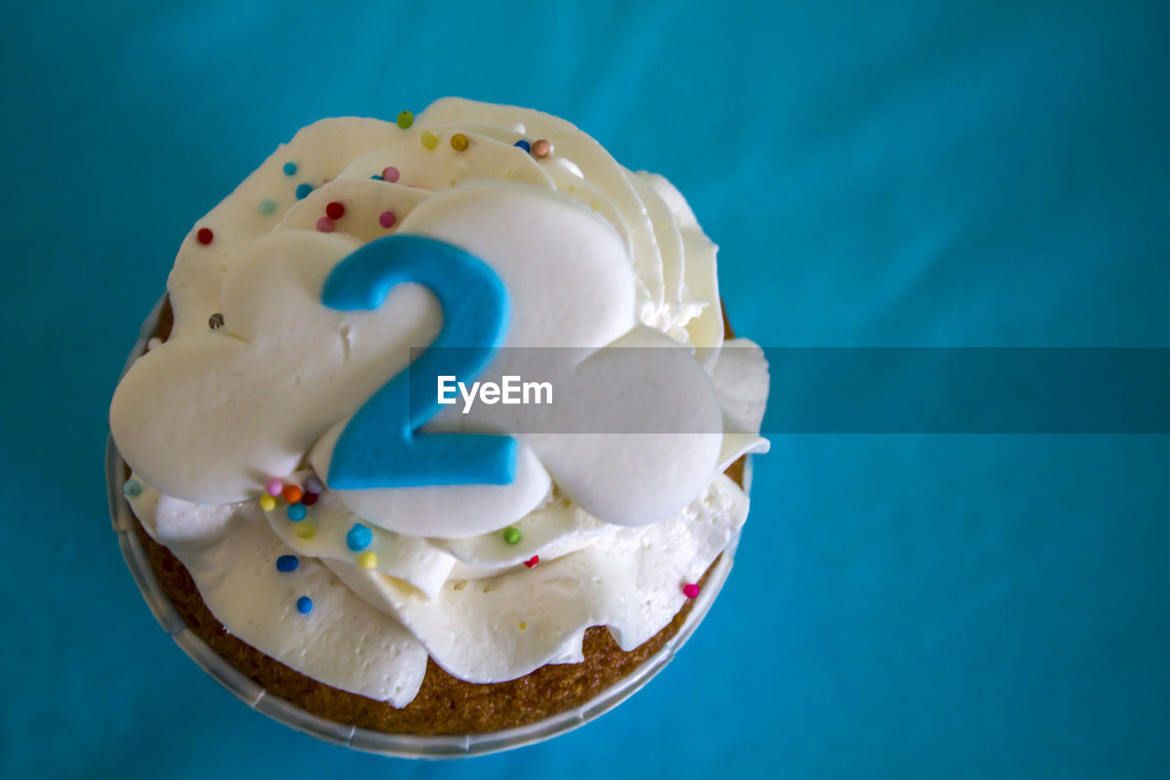 Top view of a party cupcake with number two