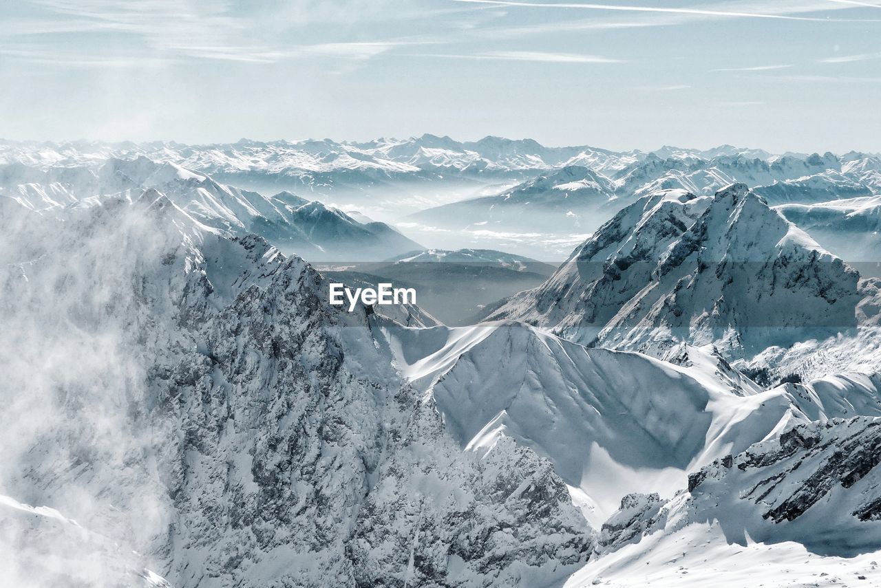 Scenic view of snowcapped mountains against sky