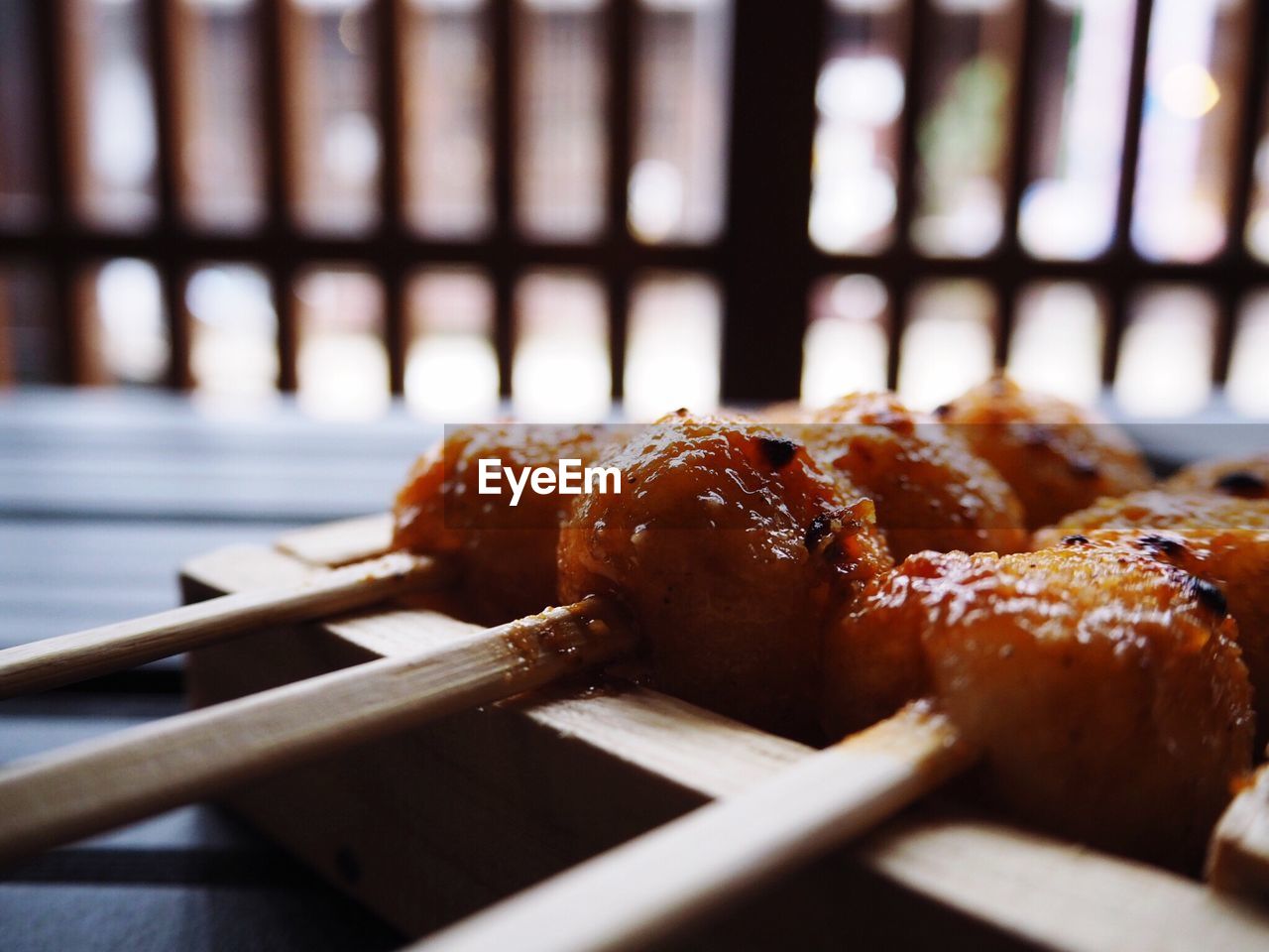 Close-up of food in wooden container on table