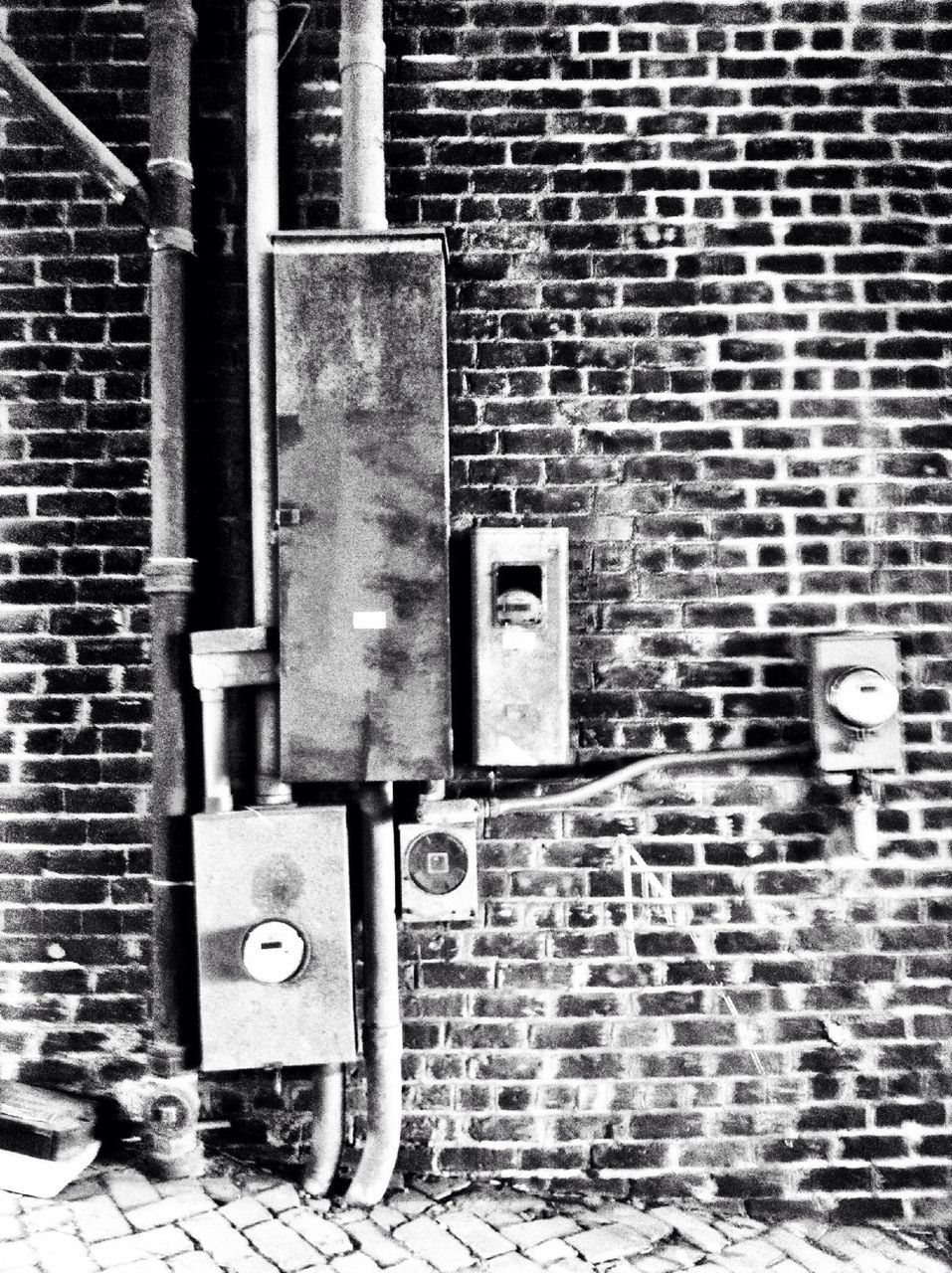 Old fuse box on brick wall