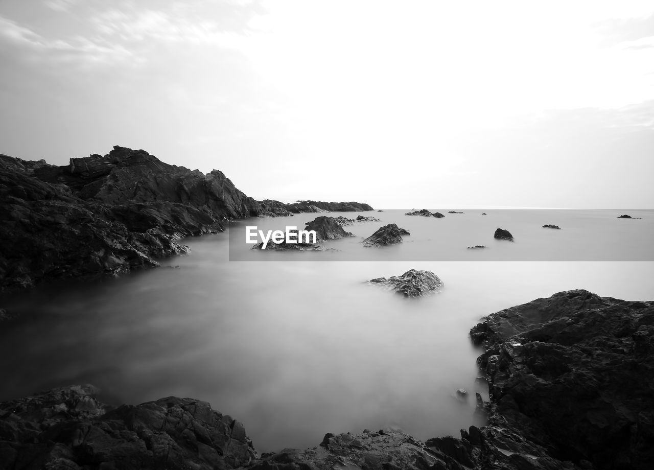 Scenic view of rock formations against sky