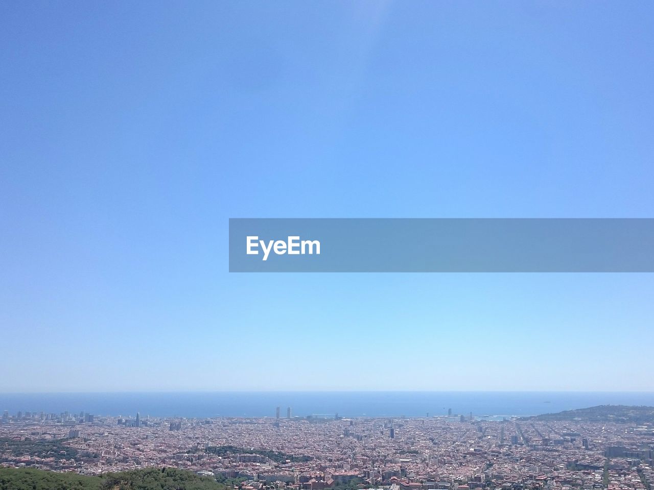 AERIAL VIEW OF CITYSCAPE AGAINST CLEAR SKY