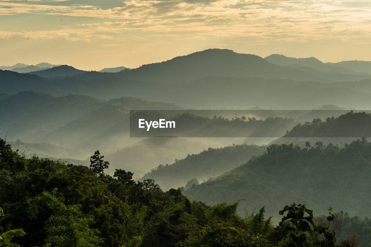 Scenic view of mountains against sky during sunset