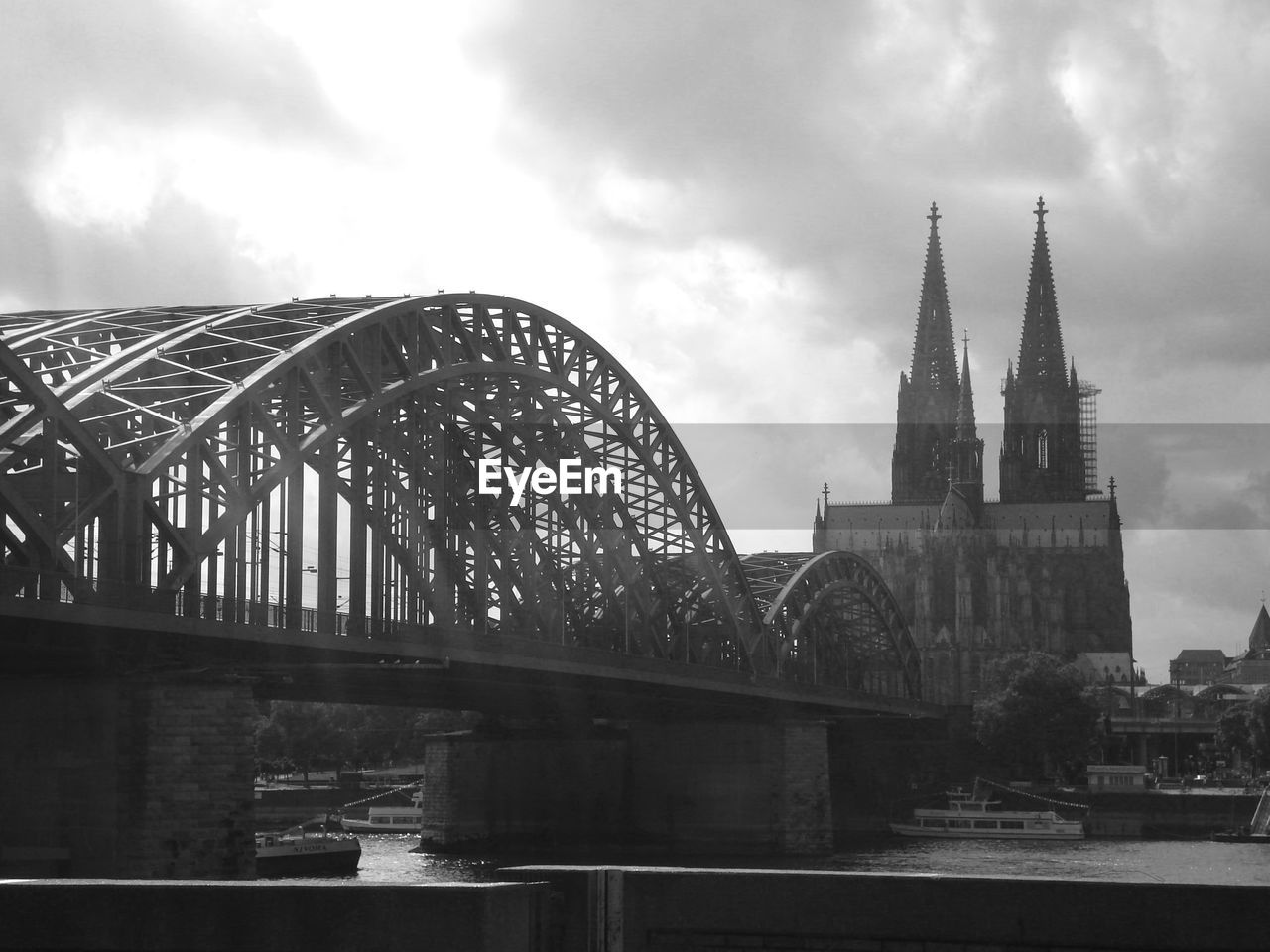 Hohenzollernbrücke over river rhein against buildings in cologne