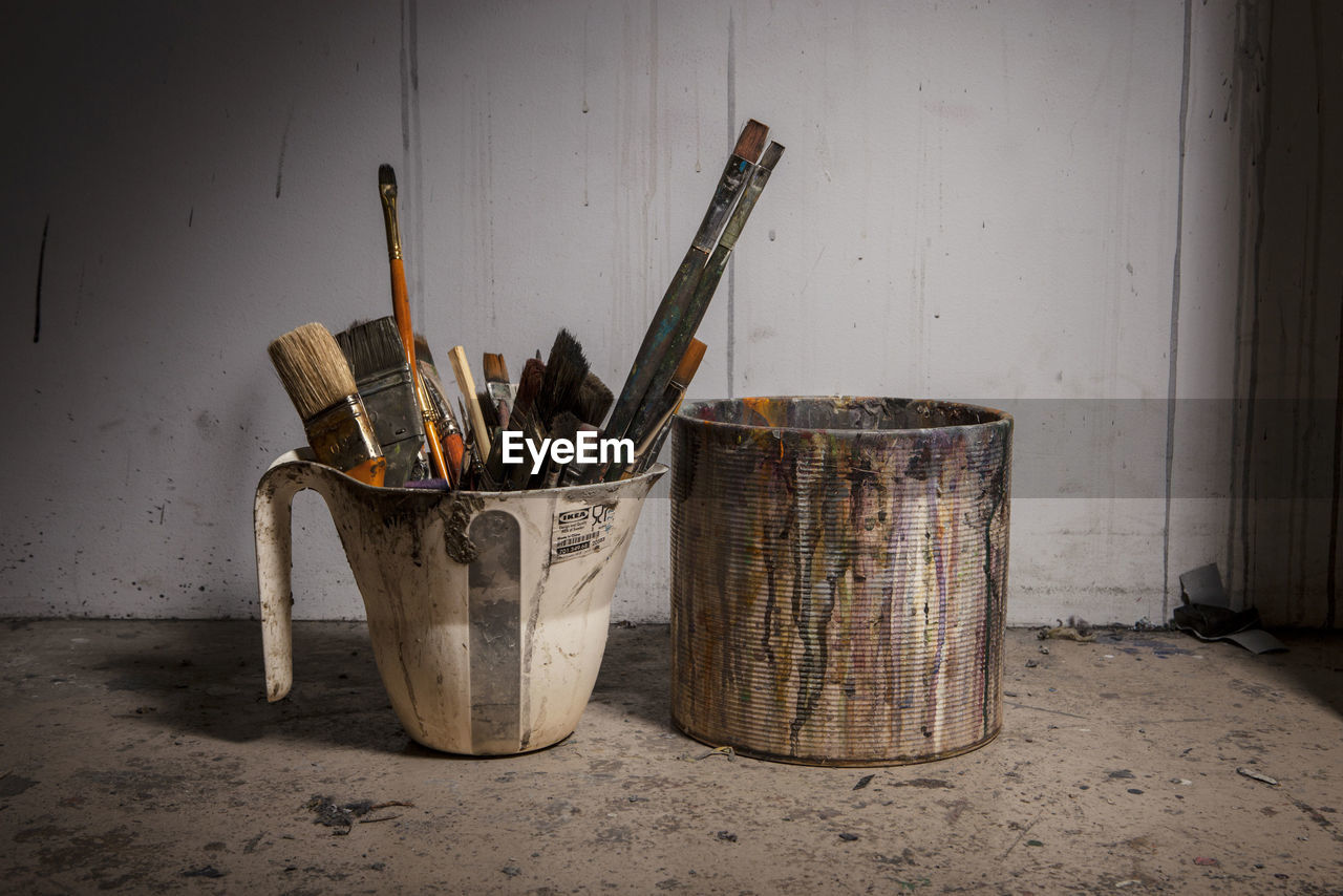 Paintbrush in stained container