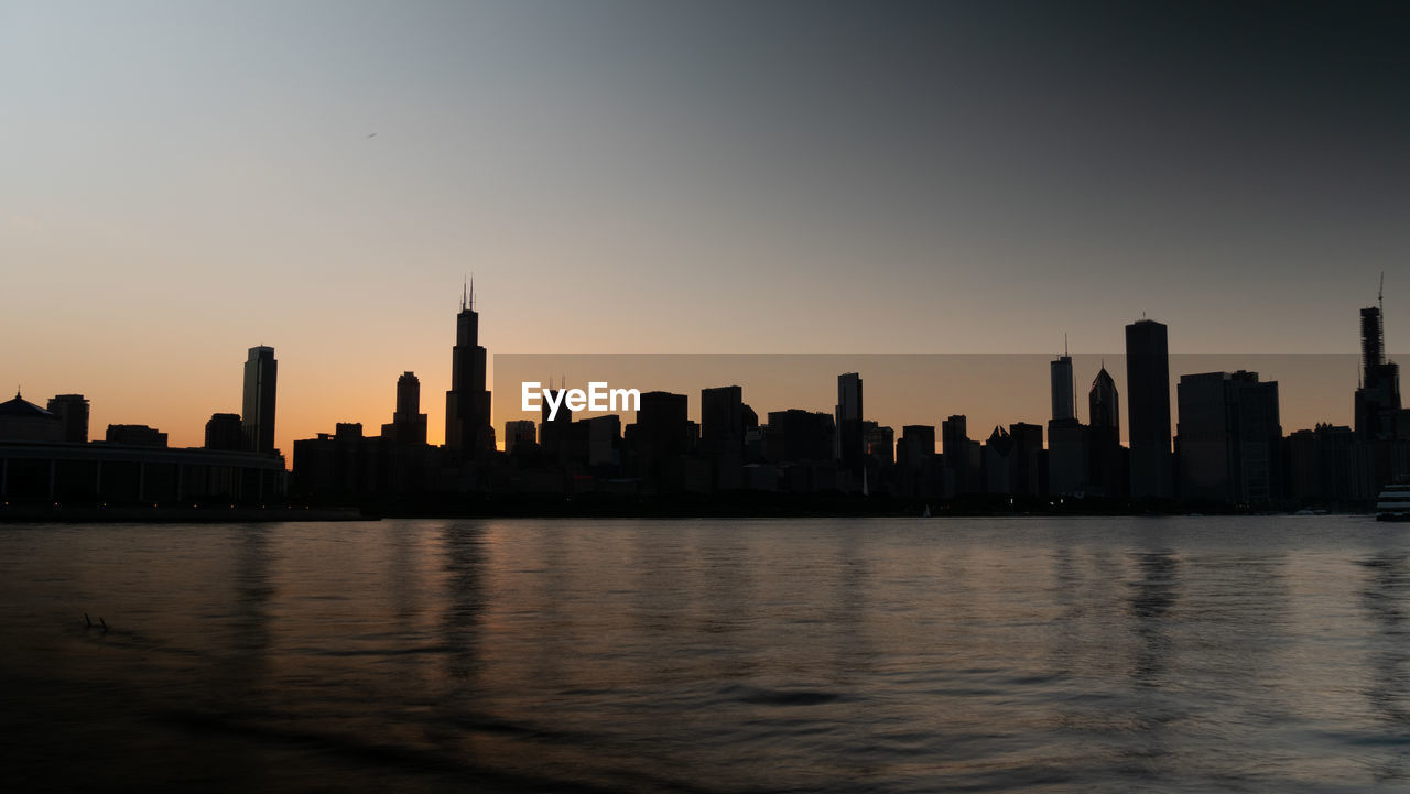 VIEW OF BUILDINGS IN CITY DURING SUNSET