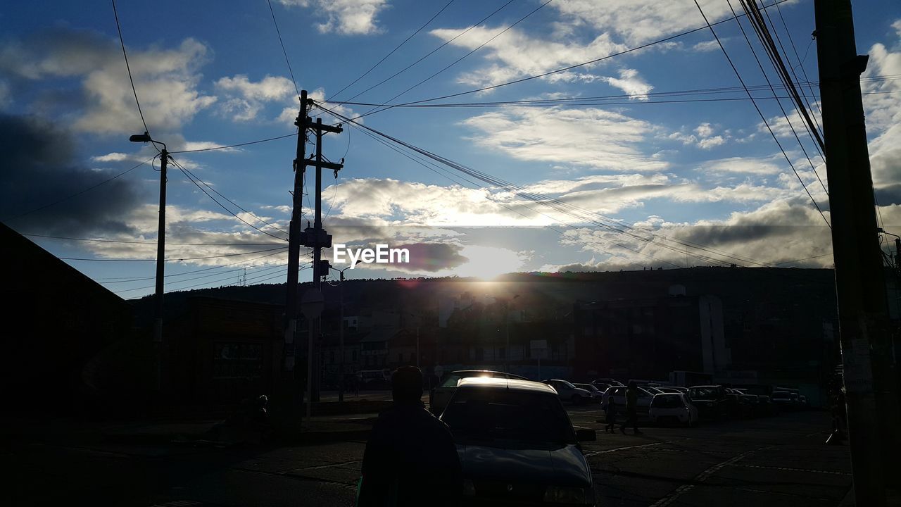 LOW ANGLE VIEW OF SILHOUETTE ELECTRICITY PYLON AGAINST SKY