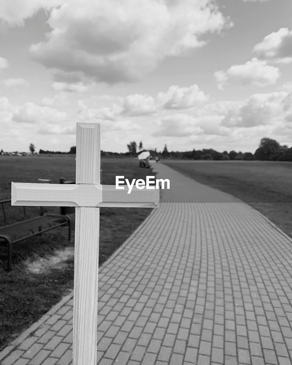 View of cross against cloudy sky