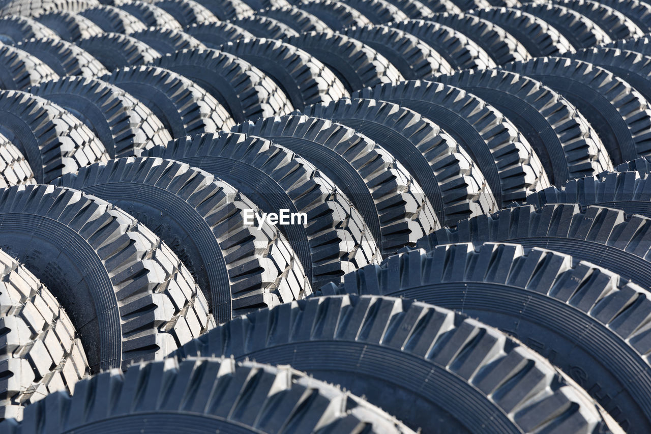 architecture, no people, pattern, tire, stadium, spiral, full frame, backgrounds, automotive tire, in a row, built structure, sport venue, repetition, circle, tread, day, shape, outdoor structure, order, high angle view