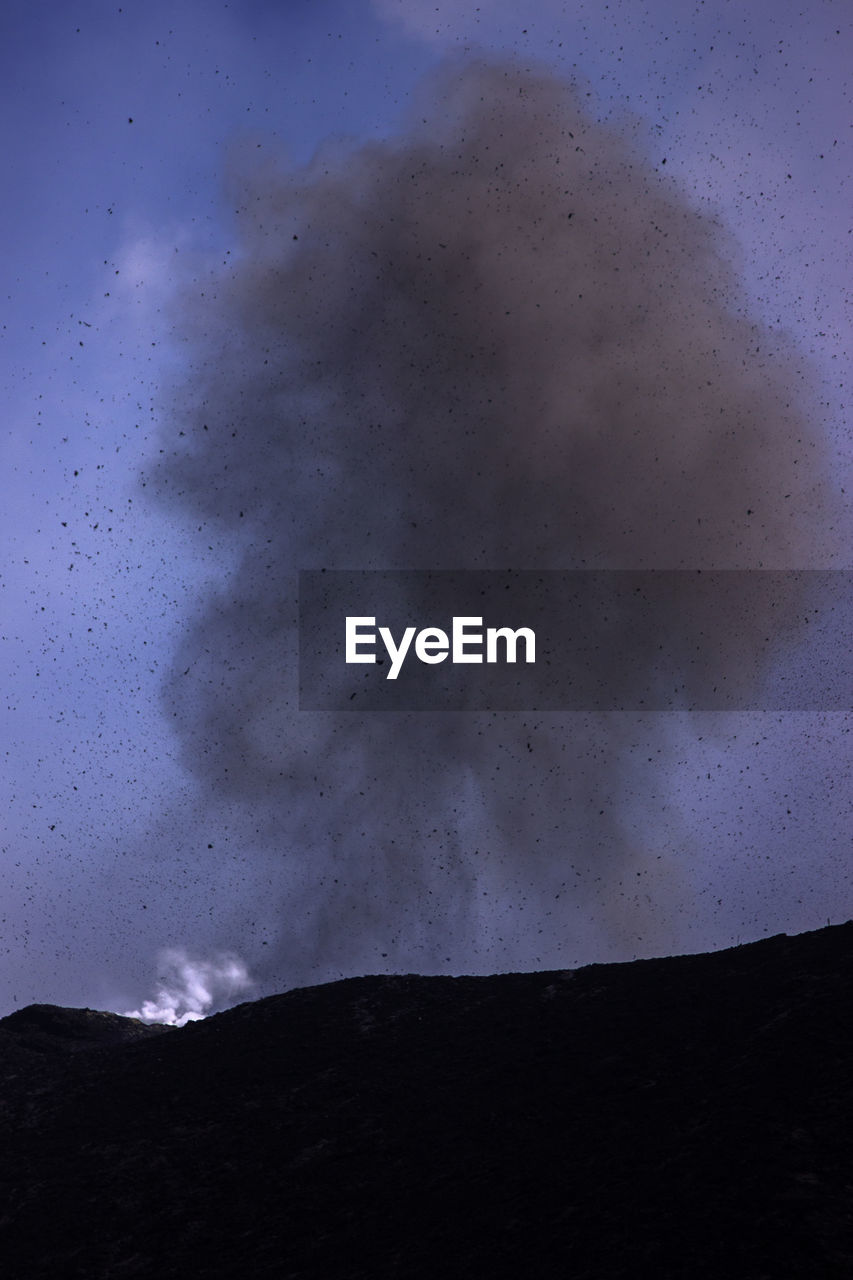 LOW ANGLE VIEW OF SILHOUETTE LAND AGAINST SKY AT NIGHT