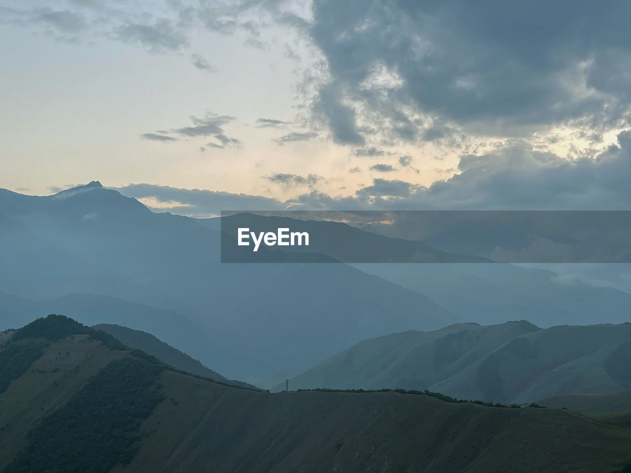 Scenic view of mountains against sky during sunset