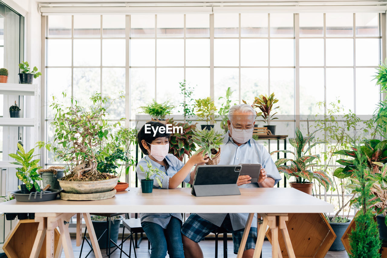 People sitting on table at home