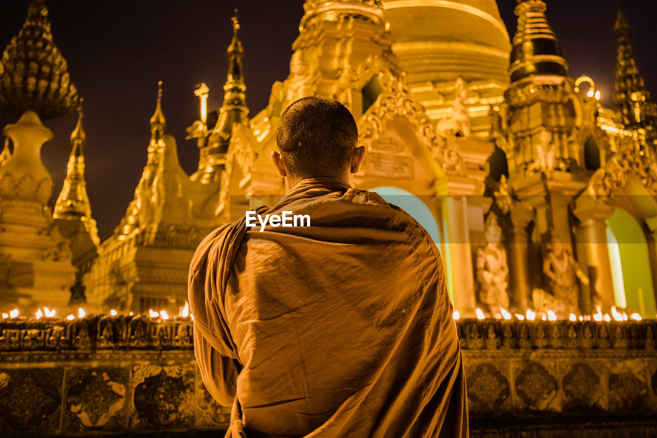 REAR VIEW OF STATUE OF BUDDHA