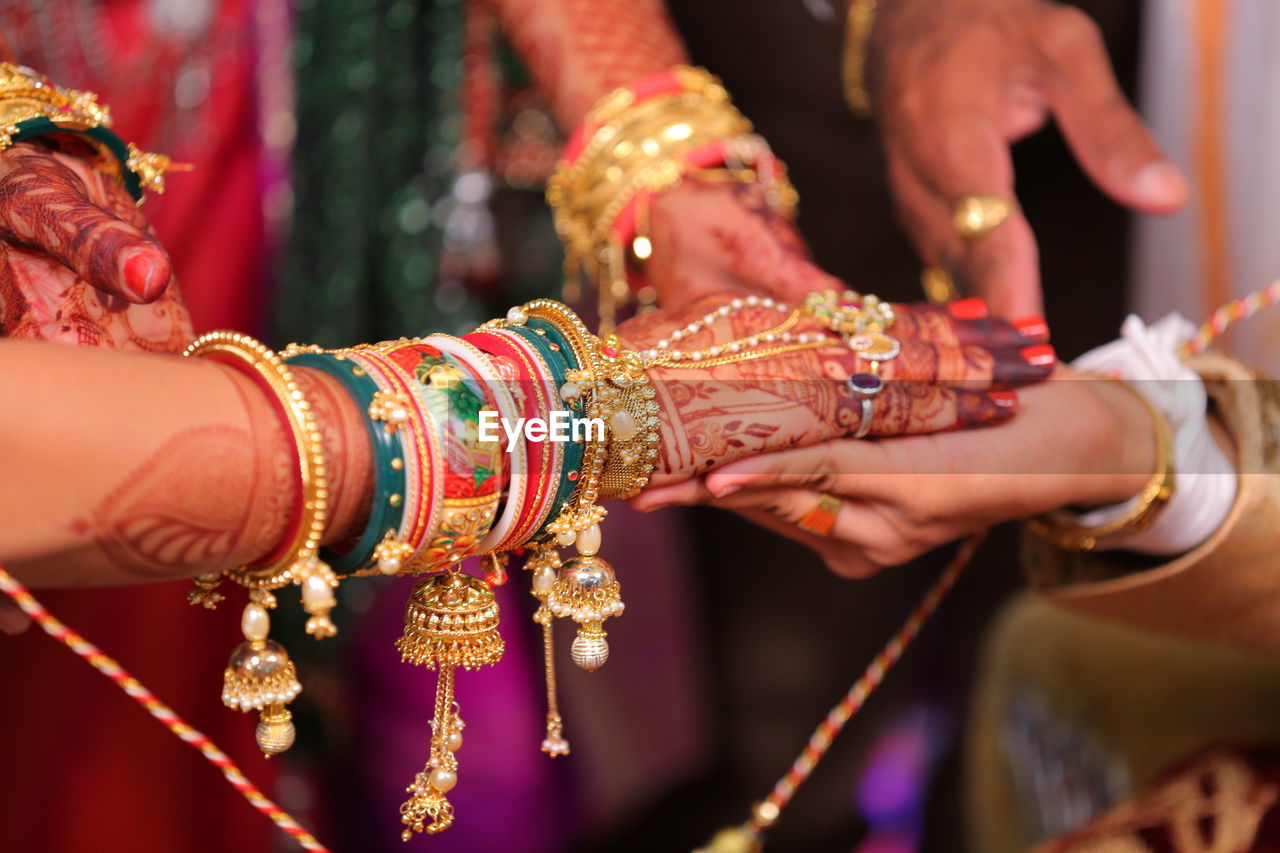 Close-up of bride and bridegroom hands during wedding ceremony