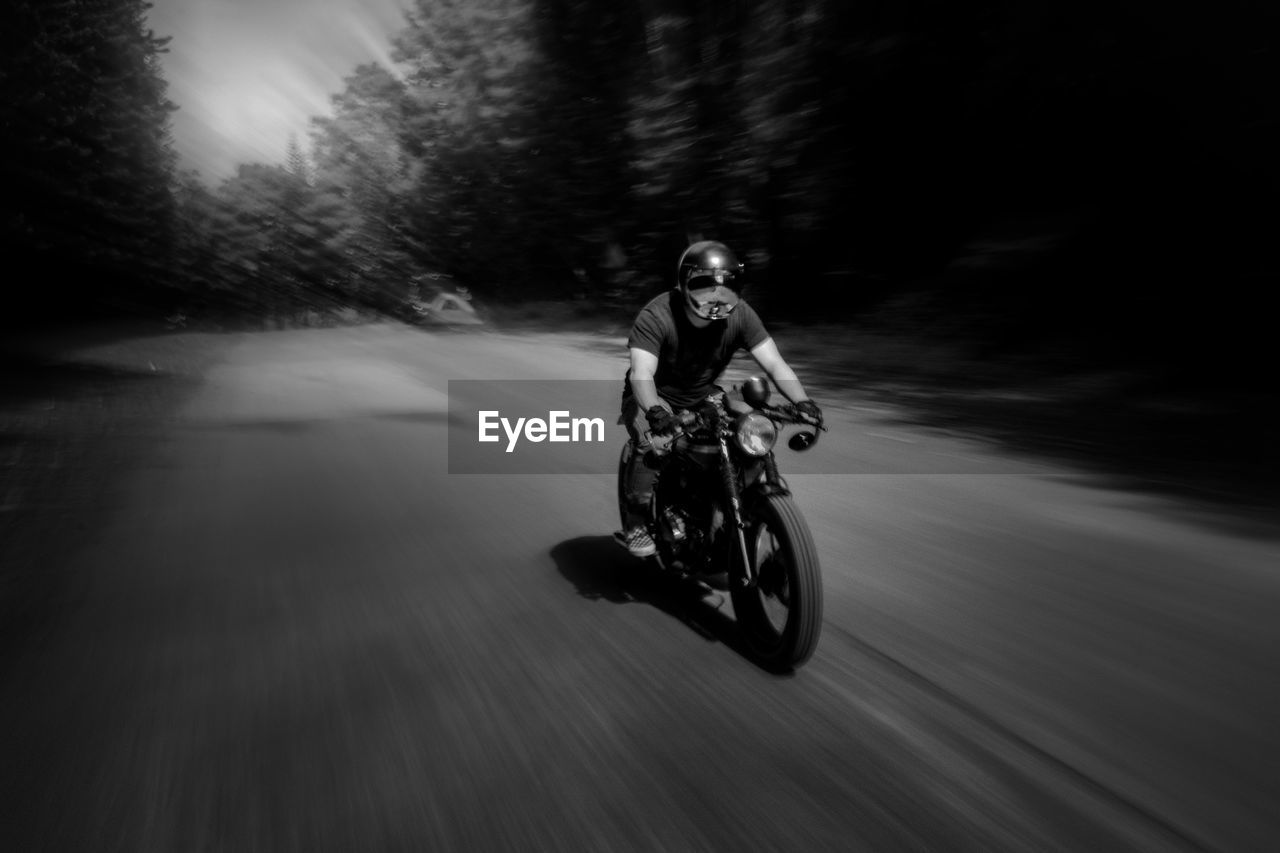 Man riding motorcycle on road